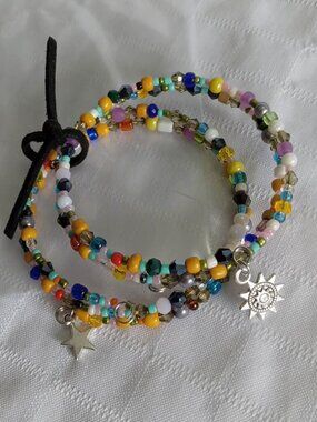 T - Handmade memory wire bracelets set with beads and pendants